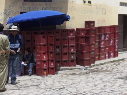 One of the many beer vendors in the plaza. Each case Contains 12 one-liter bottles.